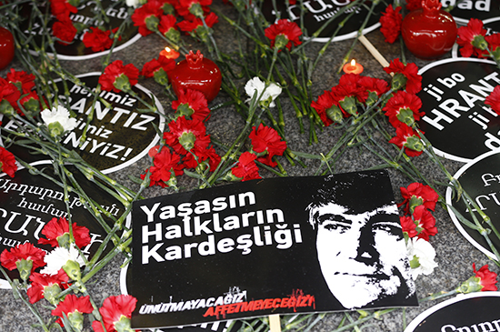On the 10th anniversary of his death, January 19, 2017, carnations, candles, and signs mark the spot in Istanbul where journalist Hrant Dink was murdered. The sign reads "Long live the brotherhood of people. We will not forget, we will not forgive." (Reuters/Osman Orsal)