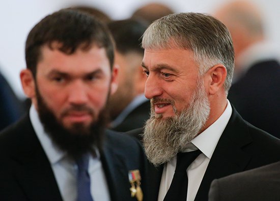 Magomed Daudov (left), the speaker of the Chechen parliament, waits for Russian President Vladimir Putin to deliver the annual state of the nation address at the Kremlin in Moscow, December 1, 2016. Daudov on January 4 threatened journalist Grigory Shvedov in a post to Instagram. (Reuters/Maxim Shemetov)