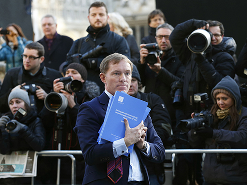 Labour MP Chris Bryant holds copies of the Leveson Report into press ethics in 2012, which led to the creation of Section 40 of the Crime and Courts Act. A consultation on enacting the restrictive legislation, which came about as a result of the inquiry, ends January 10. (AFP/Justin Tallis)