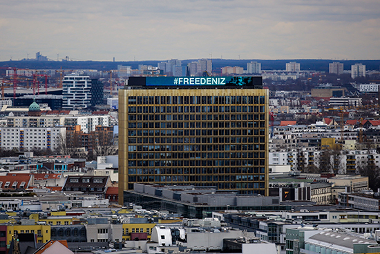 "Free Deniz" is written across the Berlin headquarters of publisher Axel Springer Markus Schreiber, February 28, 2017. (AP/Markus Schreiber)