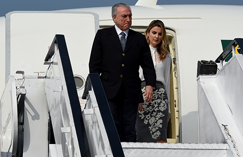 Brazil's President Michel Temer and his wife, Marcela, pictured in October 2016. Two papers were ordered to remove reports on the trial of a hacker who targeted the first lady. (AFP/Money Sharma)