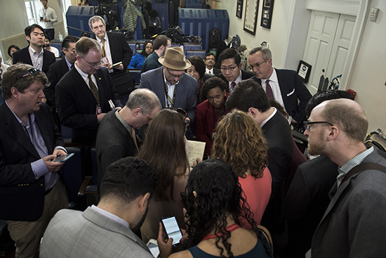 Reporters gather after being denied access to an informal White House press secretary briefing. (AFP/Brendan Smialowski)