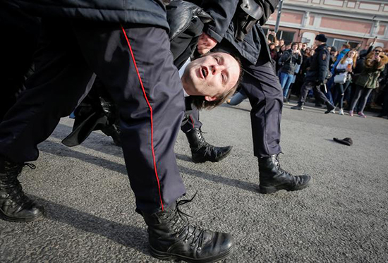 Security forces arrest a protester in Moscow, March 26, 2017. (Reuters/Maxim Shemetov)