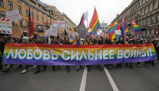 Protesters in St. Petersburg hold a banner reading "Love is stronger than war," May 1, 2014. The mayor of the nearby border city of Svetogorsk's assertion that there were no homosexuals in his town drew reporters seeking follow-up stories. (Reuters/Alexander Demianchuck)