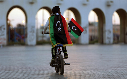 A boy celebrates the sixth anniversary of the Libyan revolution in Benghazi on February 17, 2017. Libya is divided between two rival governments. (Reuters/Esam Omran Al-Fetori)