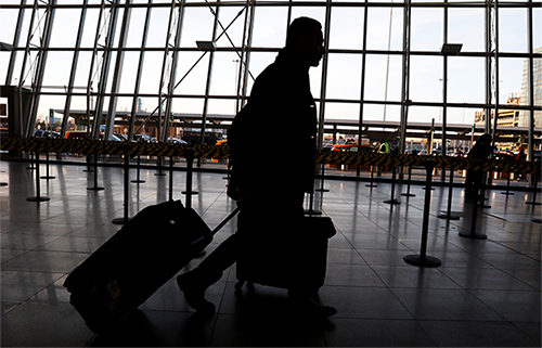 A traveler arrives at New York's JFK airport. Suggestions by the Homeland Security Secretary that passengers be asked for social media passwords would impact journalists. (Reuters/Brendan McDermid)