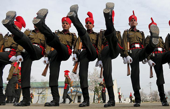 Indian Army recruits in ceremonial uniform graduate from a 49-week training program in Rangreth, Jammu and Kashmir, March 5, 2016. Journalist Poonam Argawal faces charges for an undercover investigative report alleging senior officers near Mumbai improperly ordered subordinates to carry out personal errands on their behalf.