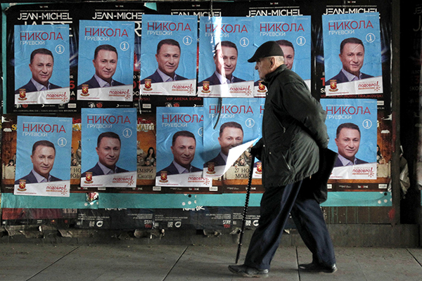 Election posters for Nikola Gruevski, of Macedonia's VMRO-DPMNE party, in Skopje in December. Gruevski, who is struggling to form a coalition government, accuses critical media of being foreign mercenaries. (AP/Boris Grdanoski)