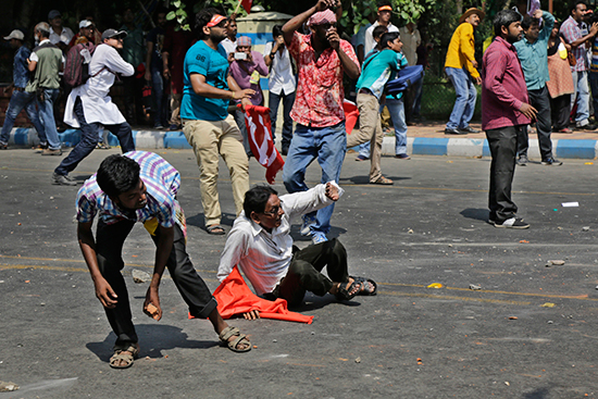 Protesters battle police in Kolkata, India, May 22, 2017. Dozens of journalists were injured as police forcibly cleared demonstrations. (AP/Bikas Das)