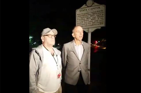In an image created from video from the American Civil Liberties Union of West Virginia's Facebook page, Dan Heyman, left, addresses the press after his release in Charleston, West Virginia, May 9, 2017.