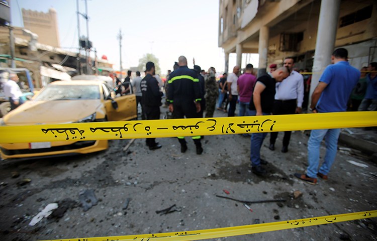 Police tape cordons off the site of a car bomb attack in Baghdad, May 30, 2017. (Reuters/Khalid Al-Mousily)