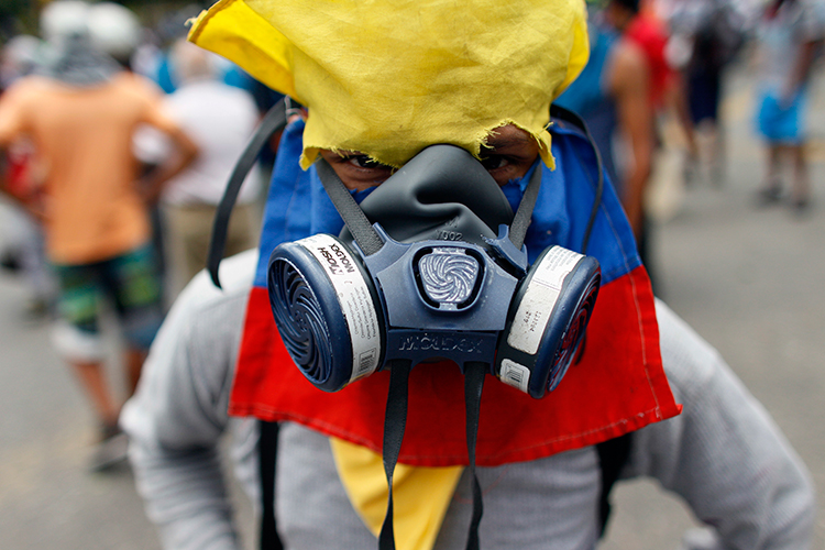 A protester poses in Caracas, June 14, 2017. (AP/Ariana Cubillos)