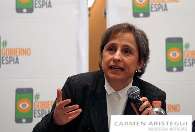 Mexican investigative journalist Carmen Aristegui speaks to reporters in Mexico City, June 19, 2017. (AP/Eduardo Verdugo)