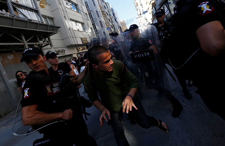 Police disperse marchers who had tried to gather for an LGBTQI pride march in Istanbul, June 25, 2017. Police also briefly detained an AP reporter (not pictured here) at the march, according to reports. (Reuters/Murad Sezer)