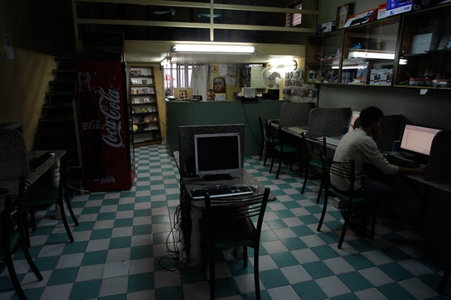 In this November 2010 file photo, a man uses a computer in an internet cafe in the West Bank town of Bethlehem (AP/Nasser Shiyoukhi)