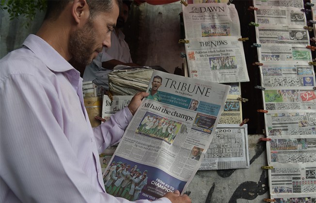 Newspapers at a stand in Islamabad in June 2017. A news crew in the city say students attacked them and damaged their vehicle this week. (AFP/Aamir Qureshi)