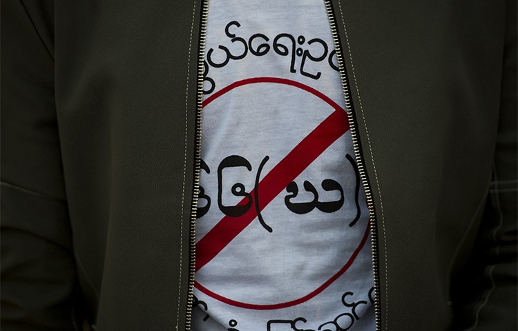 A protester wears a T-shirt denouncing Myanmar's telecommunications law in January 2017. The law is used to stifle online criticism and reporting. (AFP/Ye Aung Thu)
