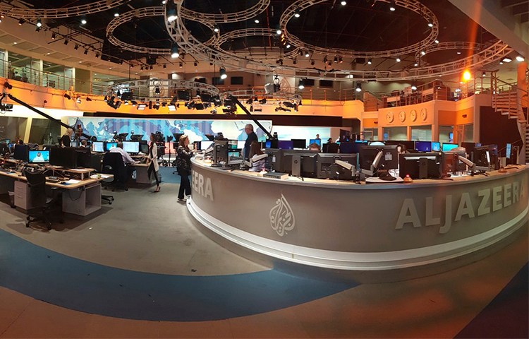 Al-Jazeera staff at the broadcaster's Doha headquarters in June 2017. Qatar's neighbors have demanded the country close the station as part of negotiations in the current political crisis. (AP/Malak Harb)
