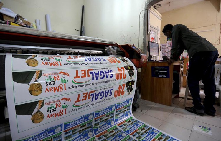 In this May 16, 2015, file photo, a printer prepares materials to commemorate the anniversary of Somaliland's declaration of independence from Somalia. (Reuters/Feisal Omar)