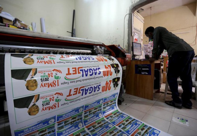 In this May 16, 2015, file photo, a printer prepares materials to commemorate the anniversary of Somaliland's declaration of independence from Somalia. (Reuters/Feisal Omar)