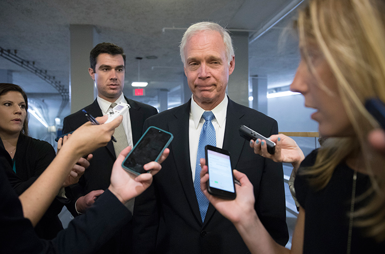 Sen. Ron Johnson, Republican of Wisconsin, center, speaks to journalists in Washington, D.C. on June 27. He released a report claiming that media leaks under the Trump Administration harm U.S. national security. (AP/J. Scott Applewhite)