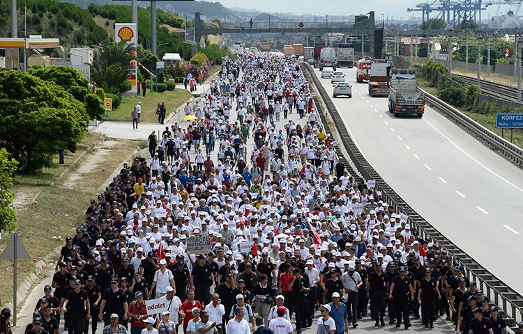 Thousands of opposition supporters pass through Izmit, Turkey, on the 21st day of a 425-kilometer (265-mile) "march for justice" to protest the jailing of opposition member of parliament and former editor Enis Berberoğlu.