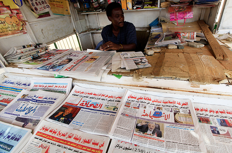 A November 13, 2015, file photo shows newspapers on display at a newsstand in Khartoum. (Reuters/Mohamed Noureldin Abdallah)