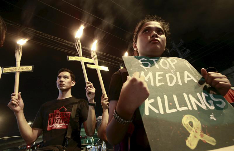 In this November 23, 2015, file photo, relatives of journalists killed march in Manila to commemorate their deaths and to demand justice. (Reuters/Romeo Ranoco)