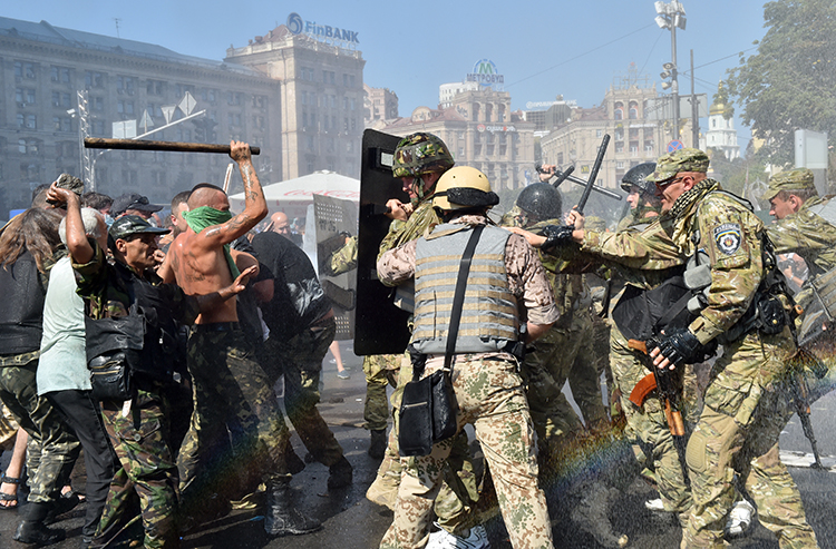 Protesters and security forces clash in Kiev during the Maidan Revolution in 2014. Sheremet’s coverage for OTR conflicted with reports from Russia's state media outlets. (AFP/Sergei Supinsky)