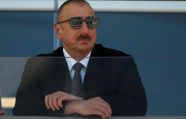 Azerbaijani President Ilham Aliyev, shown here watching a parade before a Formula 1 race in Baku, June 25, 2017, has maintained strict control over the media over the course of his 14-year rule. (Reuters/David Mdzinarishvili)