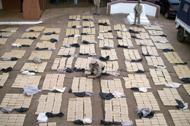 Security forces in Misiones, Argentina, display seized packets of Marijuana, August 25, 2009. (Reuters/Handout)