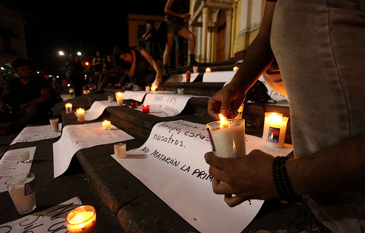 Journalists hold a late night vigil on August 1, 2015 to protest against the latest murder of a fellow journalist in Veracruz, Mexico. Mexico is one of the most dangerous countries in the world for journalists, according to CPJ research.(AP Photo/Felix Marquez)