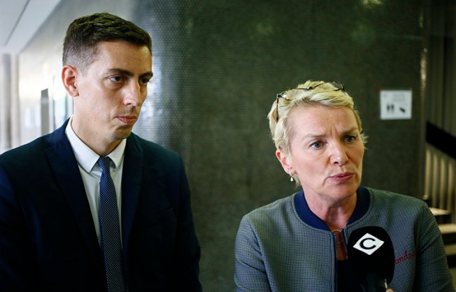 French journalists Elise Lucet, right, and Laurent Richard answer reporters' questions outside a courtroom in a Paris suburb on September 5. Azerbaijan's government brought criminal defamation charges against the two journalists for calling the country a "dictatorship." (AP/Francois Mori)