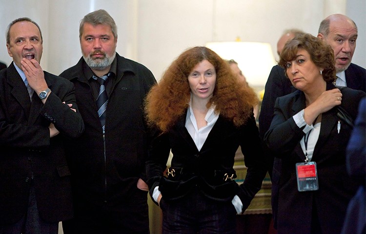 Russian journalist Yulia Latynina, pictured center in 2009 with other Novaya Gazeta journalists, is in hiding after a series of attacks on her home. (AP/Alexander Zemlianichenko)