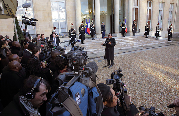 President Paul Biya speaks to journalists in Paris, France in 2013. Cameroon’s parliament removed presidential term limits from the constitution, allowing Biya to remain in office. (Reuters/Philippe Wojazer)