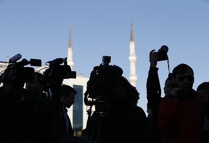Members of the media cover a protest outside an Istanbul court during the trial of about a dozen newspaper employees on October 31, 2017. (AP/Lefteris Pitarakis)