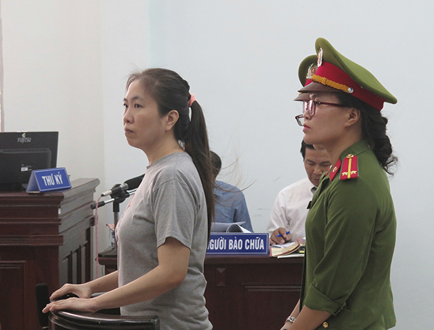 Prominent blogger Nguyen Ngoc Nhu Quynh, left, stood trial on charges of propagandizing against the state. Quynh maintains her innocence and her lawyer said her reporting did not constitute a crime. (Vietnam News Agency/AP)