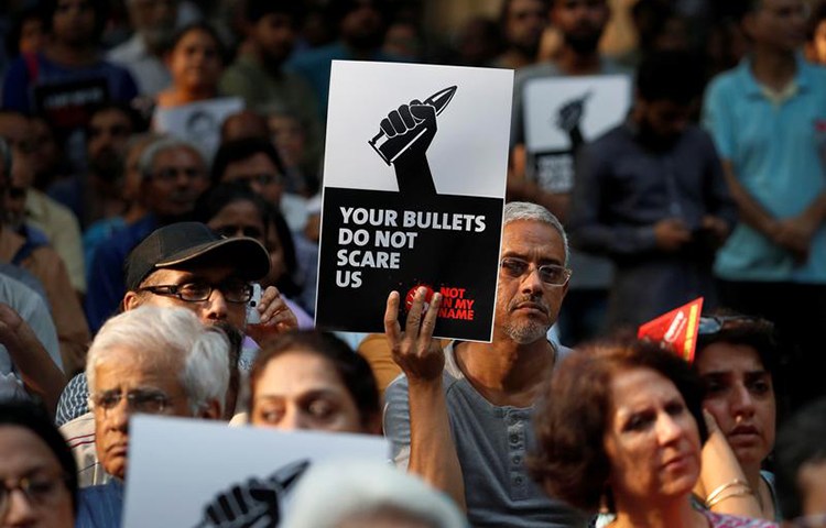 People in New Delhi protest the killing of journalists in India in September. An investigative journalist was shot dead on November 21 in Tripura state. (Reuters/Cathal McNaughton)