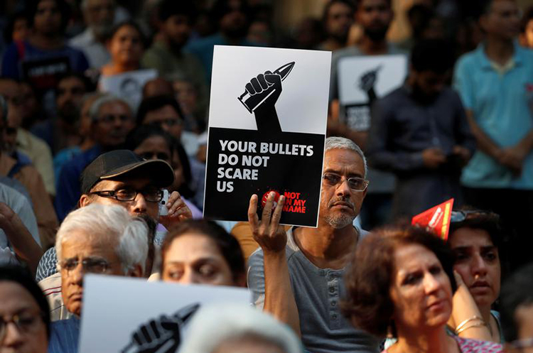 People in New Delhi protest the killing of journalists in India in September. An investigative journalist was shot dead on November 21 in Tripura state. (Reuters/Cathal McNaughton)
