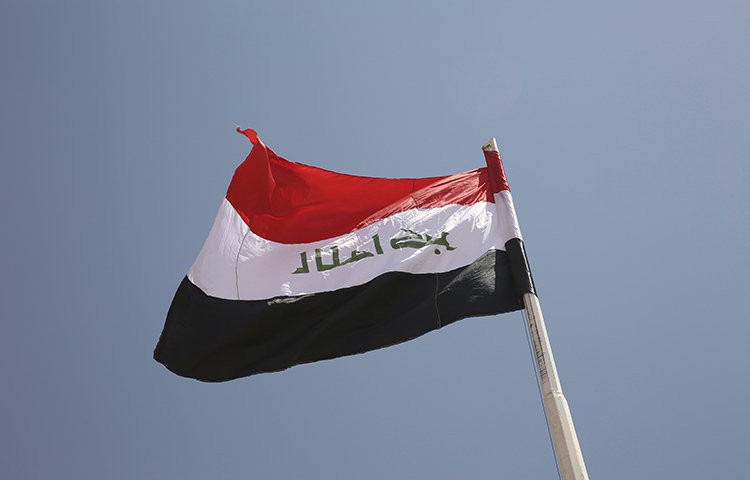 An Iraqi flag on August 30, 2017. Al-Anbar authorities on November 17, 2017, ordered a television station to close its regional offices on the grounds that they violated Iraqi licensing agreements. (AP/Sam McNeil)