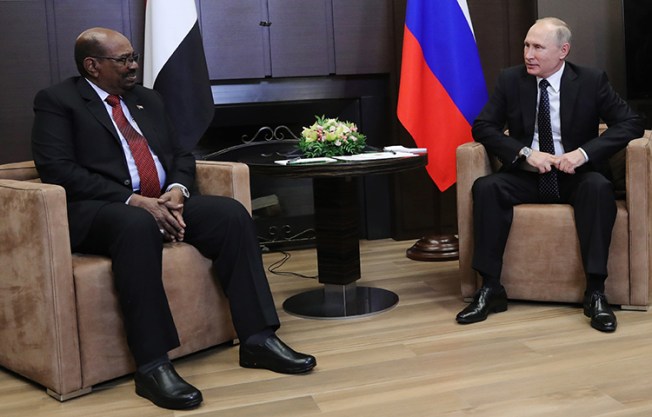 Russian President Vladimir Putin, right, talks to Sudanese President Omar al-Bashir during their meeting in Russia's Black Sea resort of Sochi, on Thursday, Nov. 23, 2017. Sudanese authorities began confiscating all copies of four opposition newspapers after they reported critically on this meeting. (AP/Kremlin Pool/Mikhail Klimentyev)