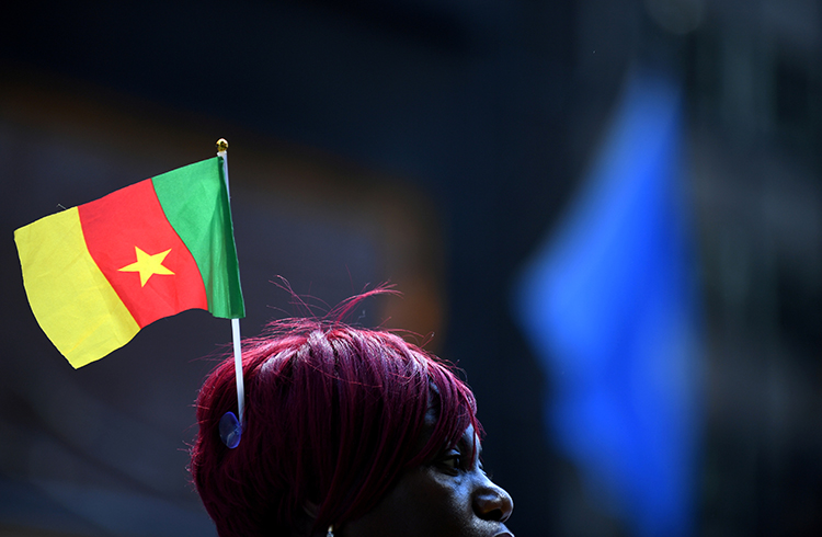A supporter of President Paul Biya waits outside a Manhattan hotel during the UN General Assembly in September. Cameroonian authorities detained a columnist in Douala on December 6 for allegedly offending the president. (Reuters/Darren Ornitz)