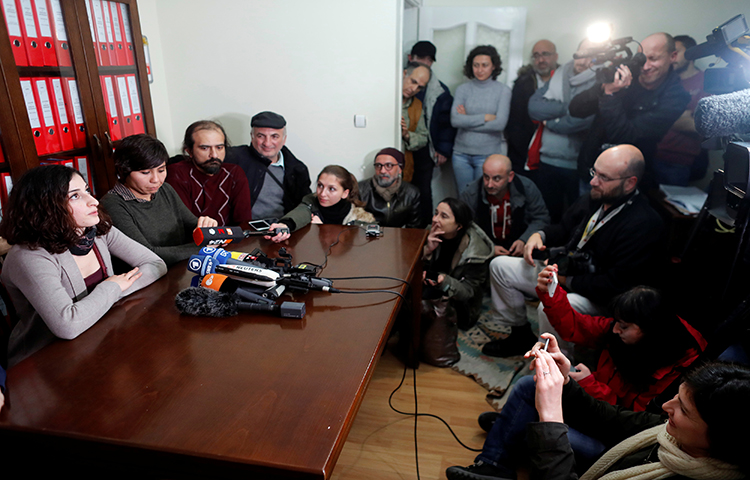 Mesale Tolu holds a news conference at her lawyer's office in Istanbul, Turkey, December 18, 2017. Tolu, who worked in Turkey as a translator for the socialist Etkin News Agency (ETHA), was released pending trial, the German news agency Deutsche Welle reported. (Reuters/Osman Orsal)