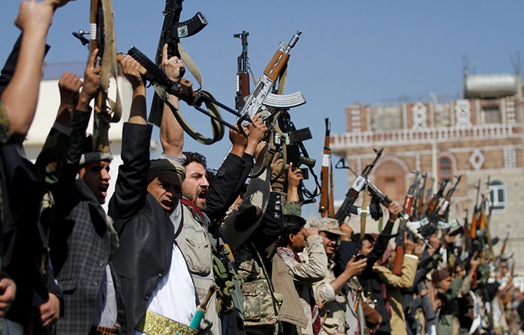 Tribesmen loyal to the Houthi movement hold their weapons as they attend a gathering to mark 1,000 days of the Saudi-led military intervention in the Yemeni conflict, in Sanaa, Yemen December 21, 2017. (Reuters/Mohamed al-Sayaghi)