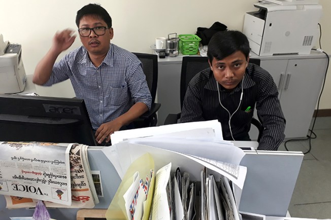 Reuters journalists Wa Lone, left, and Kyaw Soe Oo, face up to 14 years in prison for their reporting in Myanmar. (Reuters/Antoni Slodkowski)