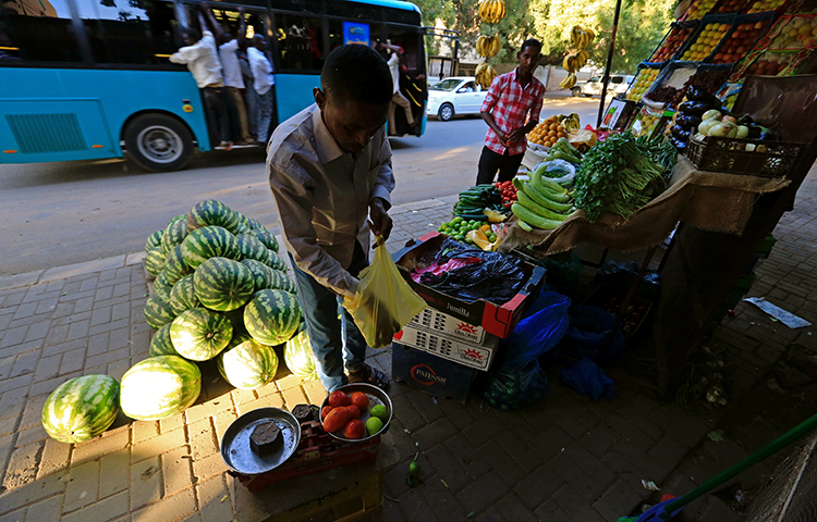 A street vendor waits for customers in Khartoum, Sudan on December 2, 2016. Akhbar al-Watan's editor, Hanady al-Siddiq, told journalists in a written statement that the government's recent confiscation of critical newspapers is likely related to the newspapers' coverage of rising food prices in the country. (Reuters/Mohamed Nureldin Abdallah)