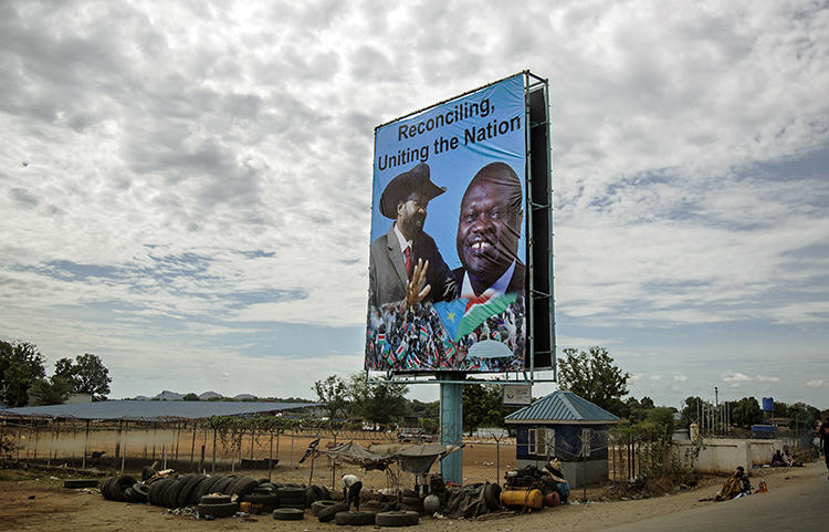 A billboard featuring President Salva Kiir, left, and opposition leader Riek Machar, is displayed in Juba in 2016. South Sudan is due to resume peace talks under an agreement that includes calls for an end to harassment of the press. (AFP/Albert Gonzalez Farran, CDS)
