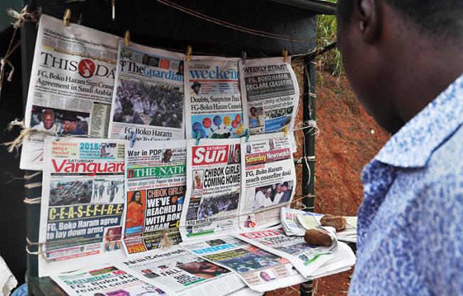 A news stand in Abuja, Nigeria in October 2014. A Nigerian court is scheduled to arraign brothers Timothy and Daniel Elombah, editor and chief executive respectively, of the independent Elombah news website, on cybercrime and terrorism-related offenses on March 1, 2018.(Reuters/ Stringer)