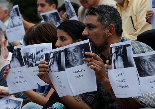 Journalists and activists hold photos of journalists killed in Mexico. (Reuters/Henry Romero)