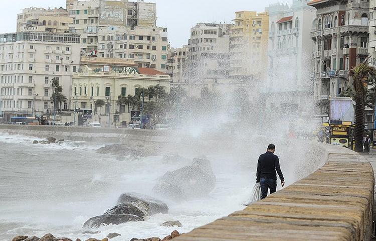 Stormy weather hits the Egyptian port city of Alexandria in January 2018. Police in the city are detaining two journalists for allegedly filming without a license. (AFP/Stringer)